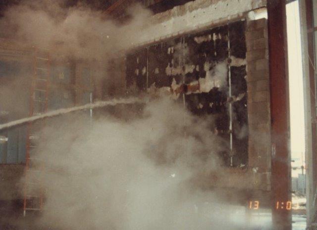 30 psi cold hose stream over the entire face of the wall section