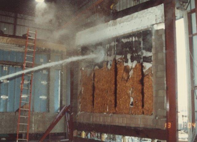 30 psi cold hose stream over the entire face of the wall section